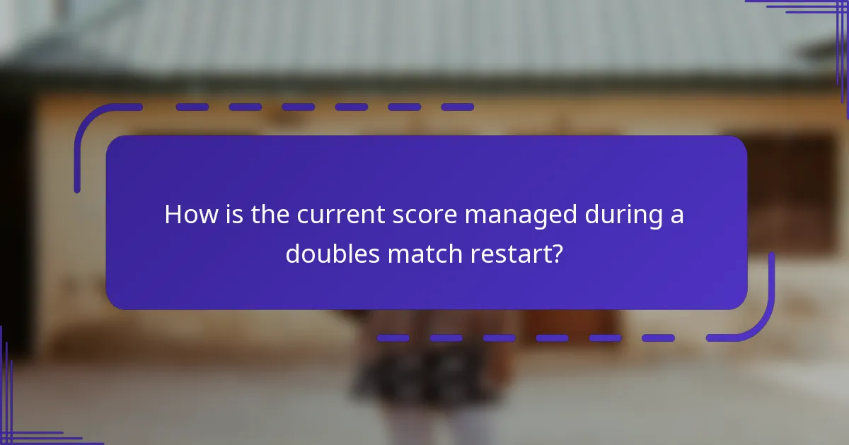 How is the current score managed during a doubles match restart?