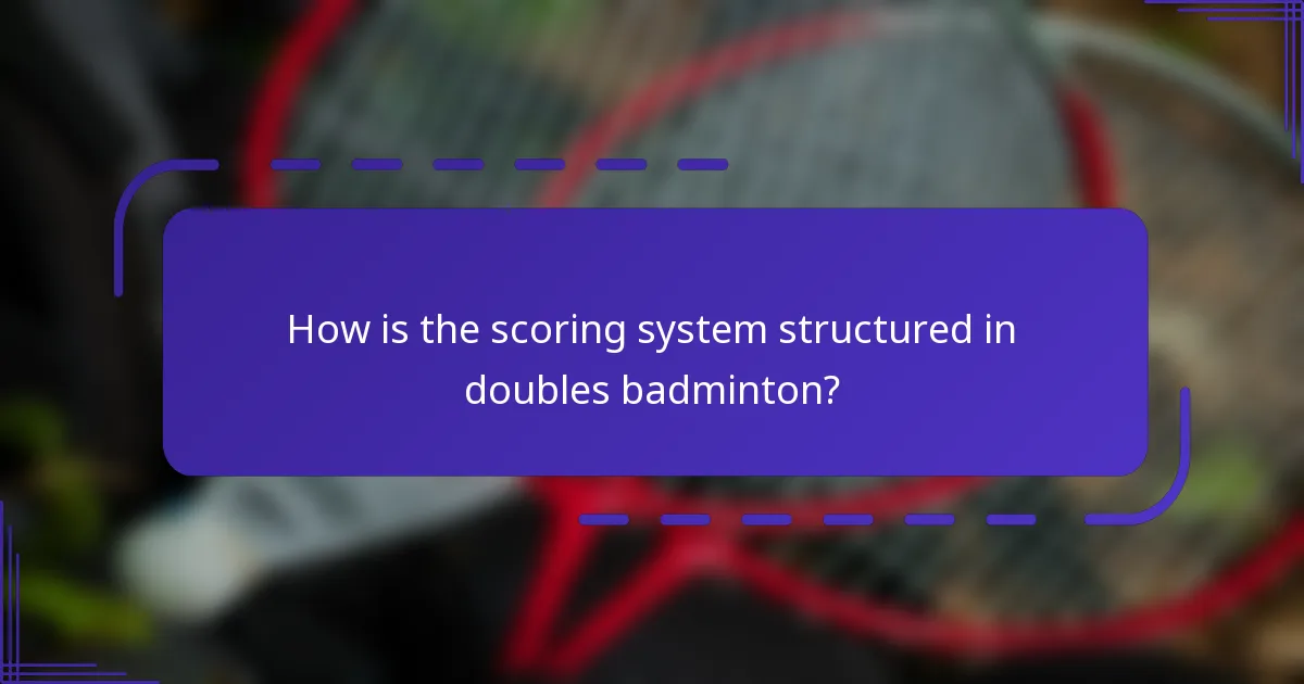 How is the scoring system structured in doubles badminton?